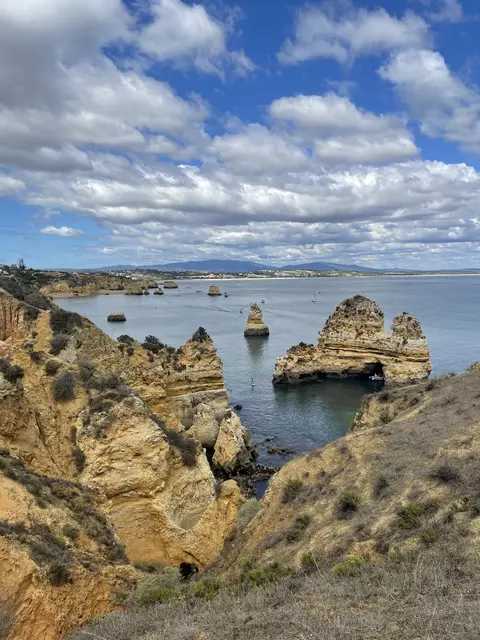 Sea stacks and golden cliffs along the Lagos coast in the Algarve